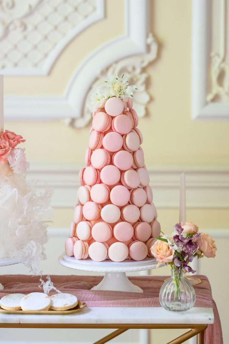 Pink macaron tower, by Sugar & Stories, with flowers at 10-11 Carlton House Terrace, London
